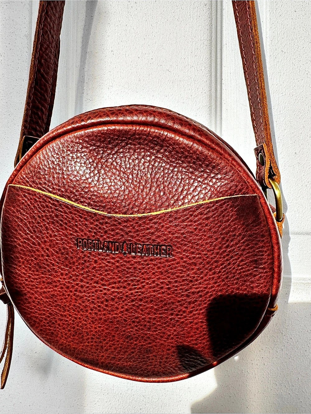 Portland Leather Round Leather Crossbody Bag in Brown